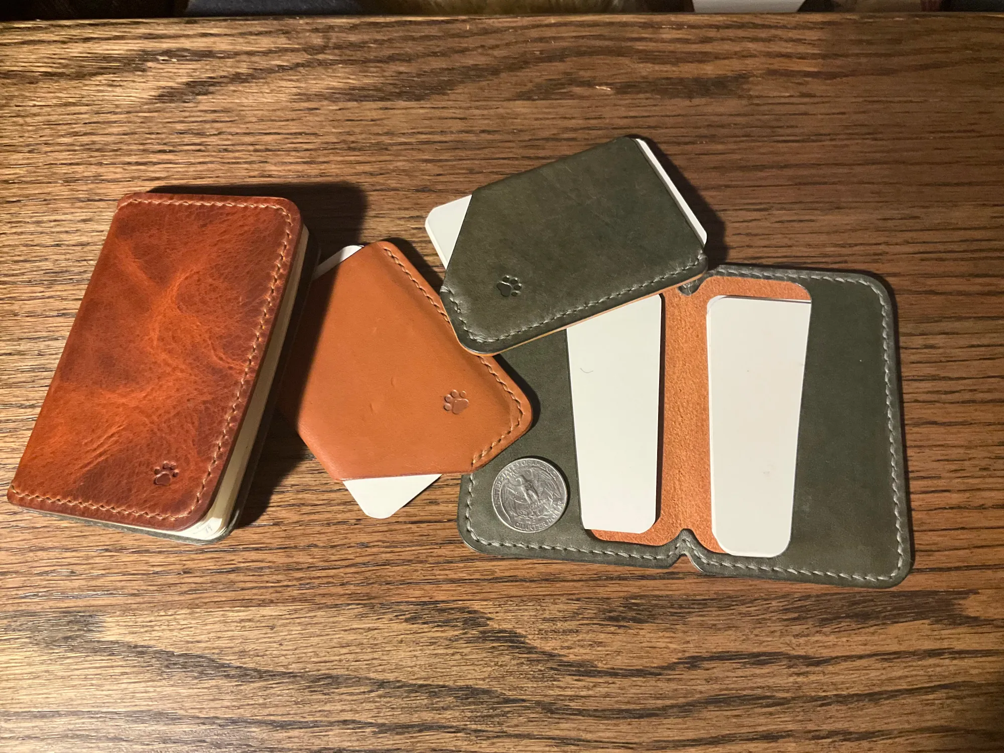 Picture showing various homemade leather goods, including notebook covers, wallets, and index card holders